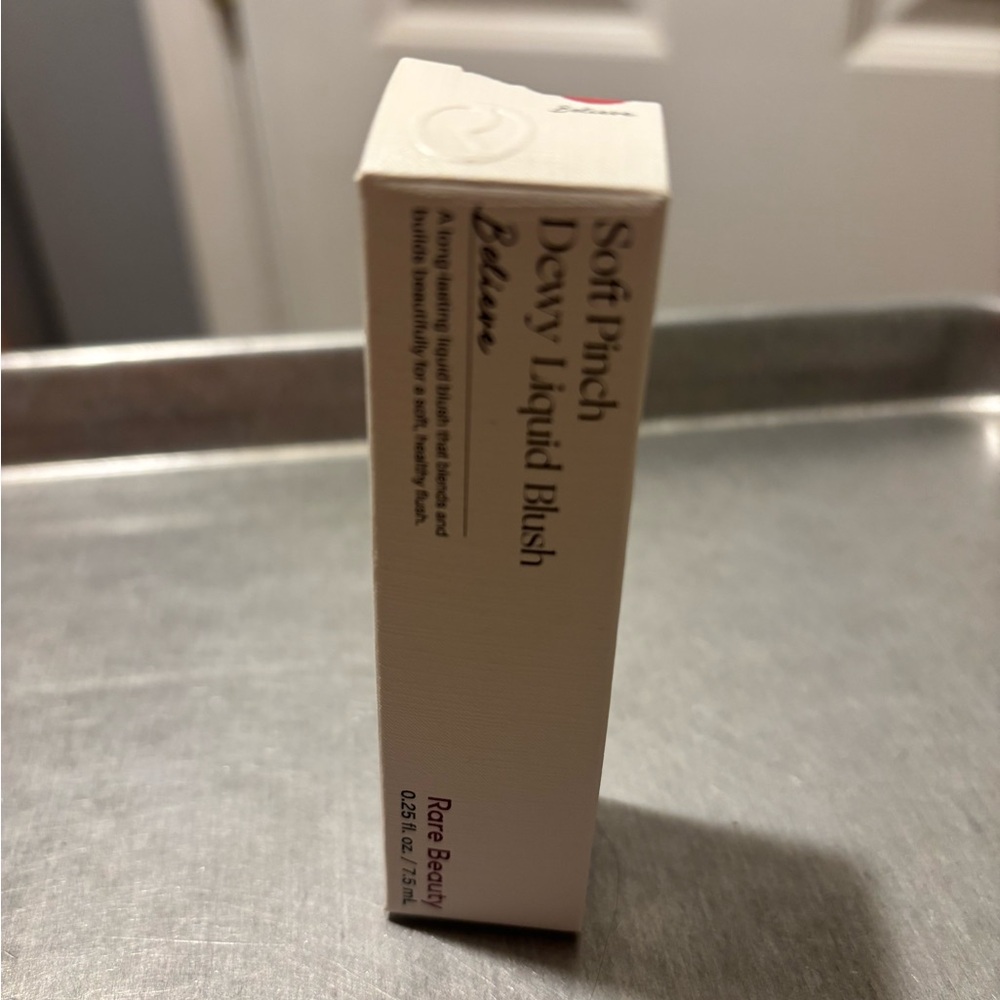 Rare Beauty liquid blush in muted mauve-brown